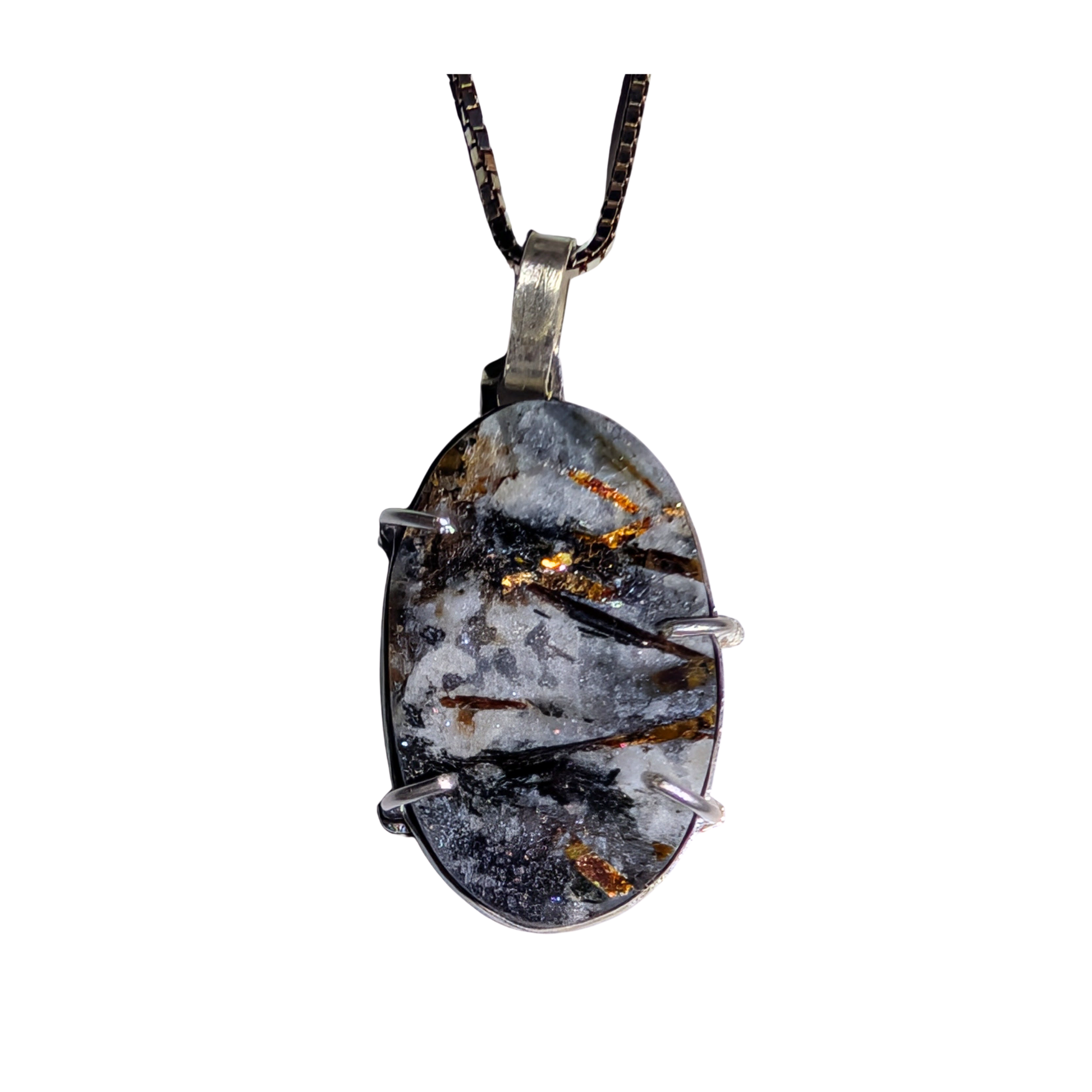 An oval pendant necklace featuring a dark gray and white marbled stone with metallic gold and copper inclusions, held in a silver-toned metal bezel and suspended from a black chain.
