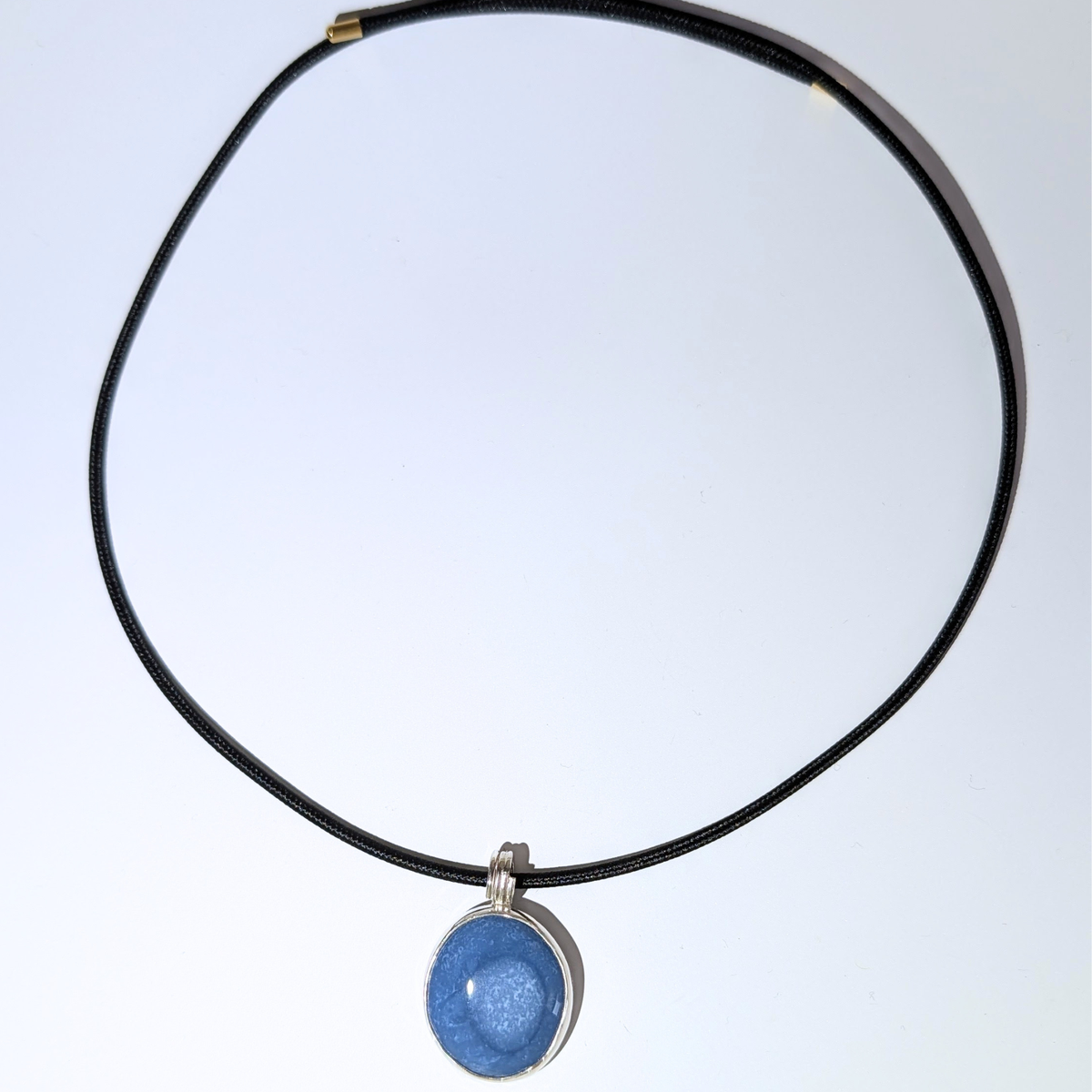 Oval Blue Opal Pendant on black Cord